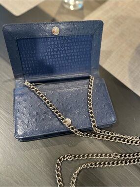 Kate Spade navy leather crossbody with gold logo plate